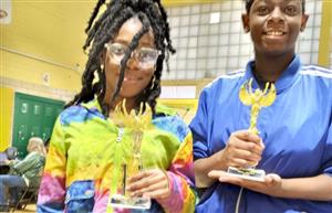 SWA students posing w/the trophies